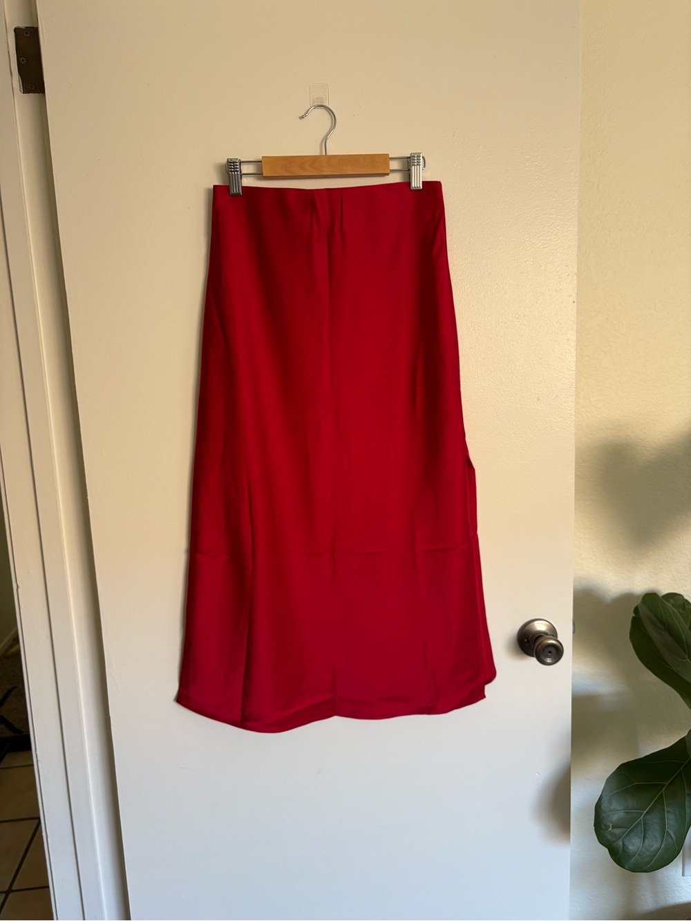 Red satin midi skirt with side slit